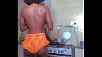 Hot girl cooking and dancing